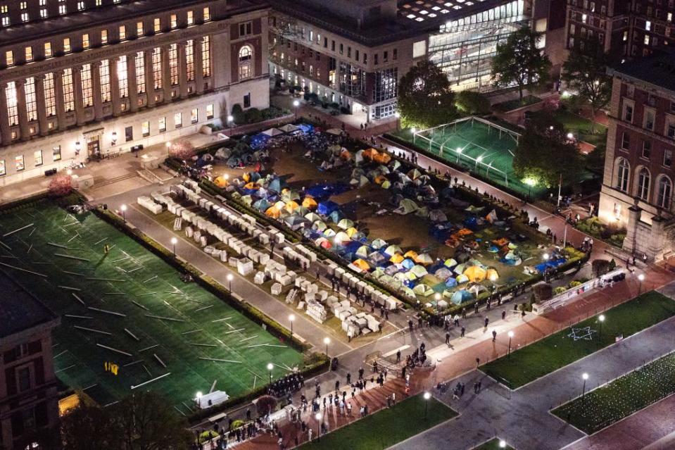 NYPD officers surround the pro-Palestinian encampment on the lawn of Columbia University on Tuesday. New York Post