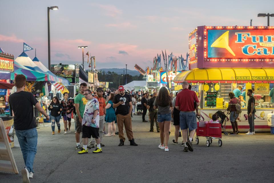 Fairgoers visit the NC Mountain State Fair on September 12, 2022.