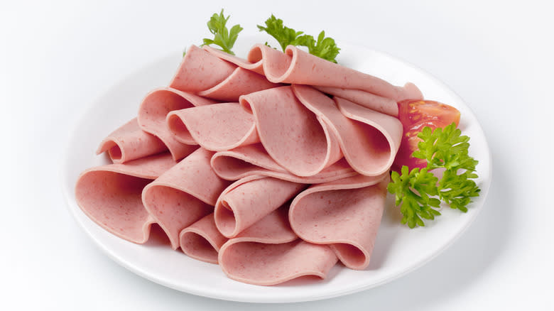 Bologna slices on plate