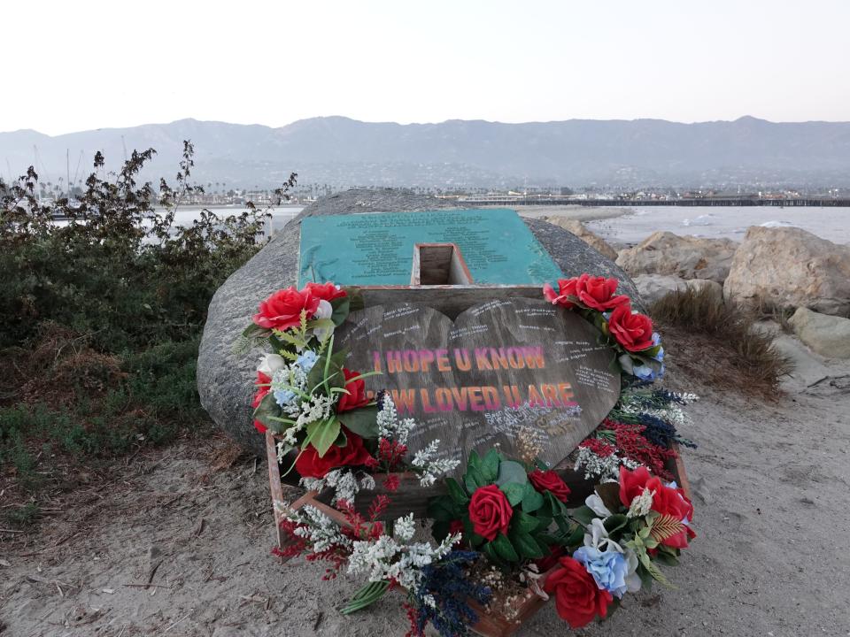 A heart-shaped sign surrounded by flowers leans against the memorial for victims of the Conception boat fire at Santa Barbara Harbor on the eve of the disaster's third anniversary in September.