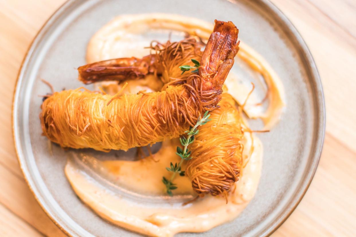 Kataifi prawns, a small plate served at Avli restaurants, wraps shredded phyllo dough around the prawns and serves them with spicy mayonnaise and herb oil. The Chicago restaurant group plans to open a modern Greek restaurant in Brewers Hill in Milwaukee.