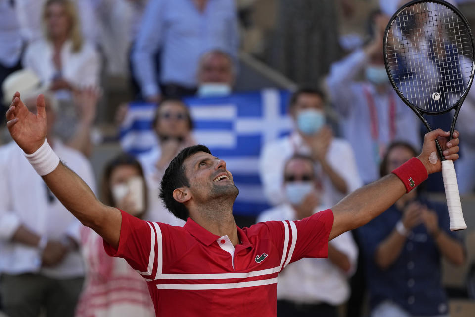 Serbia's Novak Djokovic celebrates after defeating Stefanos Tsitsipas of Greece in their final match of the French Open tennis tournament at the Roland Garros stadium Sunday, June 13, 2021 in Paris. (AP Photo/Michel Euler)