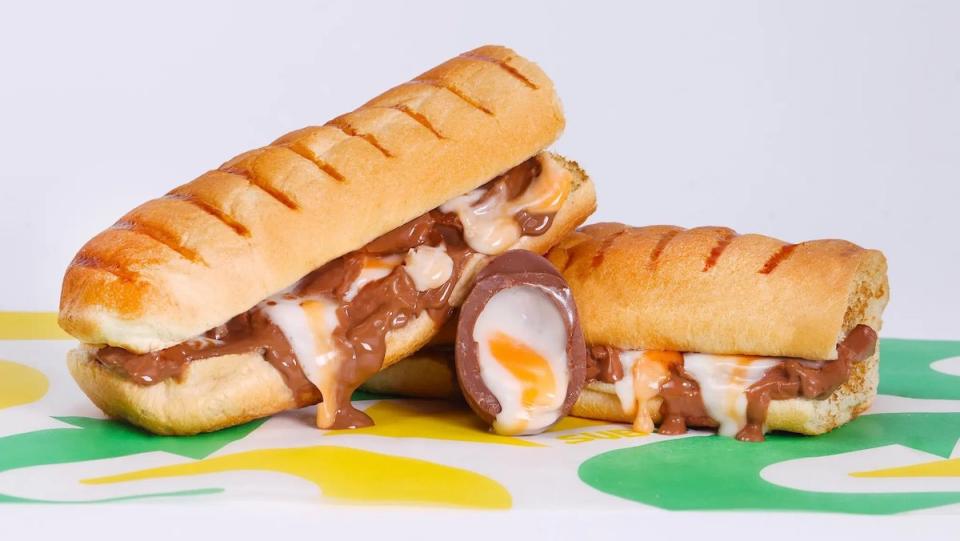 A sub cut in half featuring melted Cadbury Creme Egg with a split egg in front from Subway UK