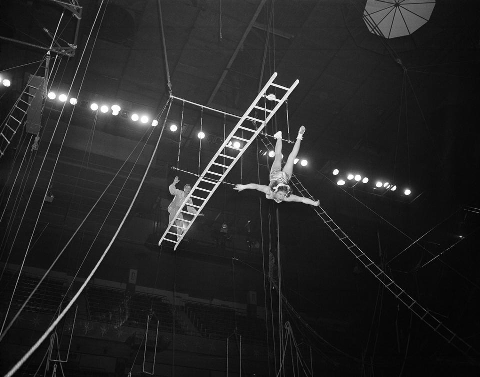 <p>The Rixos on their balanced ladder on a trapeze rehearse their act for Ringling Bros. and Barnum and Bailey Circus at Madison Square Garden, New York, March 30, 1954. (AP Photo/Matty Zimmerman) </p>