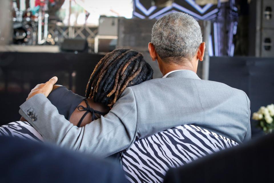 <p>Former US president Barack Obama (R) holds his half-sister Auma Obama (L), during an opening ceremony of the Sauti Kuu Sports, Vocational and Training Centre in his ancestral home Kogelo, some 400km west of the capital Nairobi, Kenya on July 16, 2018. (Photo: Dai Kurokawa/EPA-EFE/REX/Shutterstock) </p>