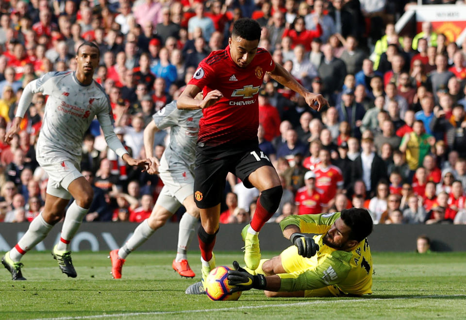 Liverpool goalkeeper Alisson’s first-half save on Manchester United striker Jesse Lingard helped the Reds earn a point at Old Trafford. (Reuters/Phil Noble)