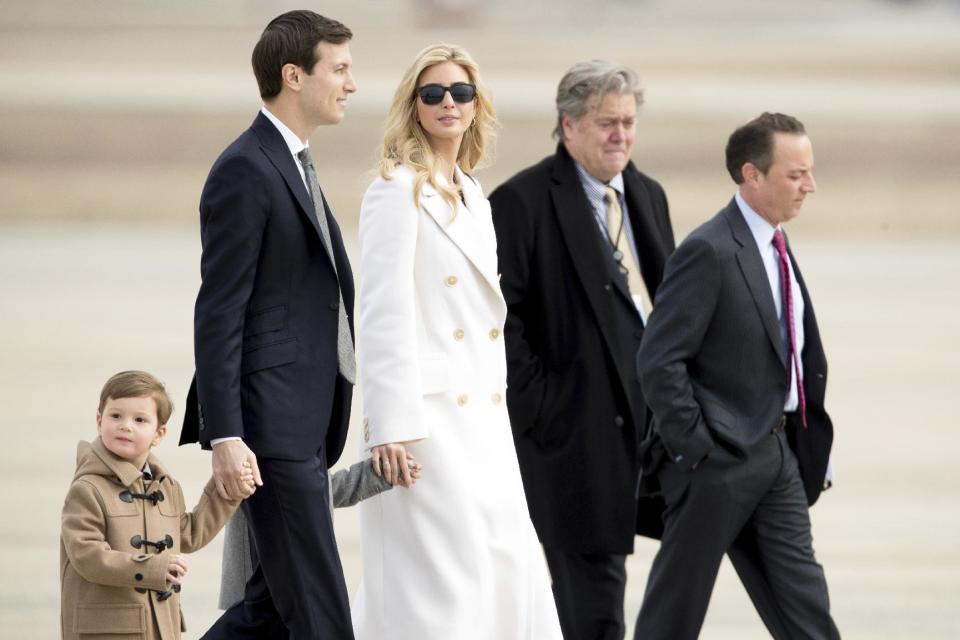 Ivanka Trump, daughter of President Donald Trump, her husband, senior adviser Jared Kushner, their two children Arabella Kushner and Joseph Kushner, Chief White House Strategist Steve Bannon, second from right, and Chief of Staff Reince Priebus, right, walk to Air Force One at Andrews Air Force Base in Md., Friday, Feb. 17, 2017. Trump is visiting Boeing South Carolina to see the Boeing 787 Dreamliner before heading to his estate Mar-a-Lago in Palm Beach, Fla., for the weekend. (AP Photo/Andrew Harnik)