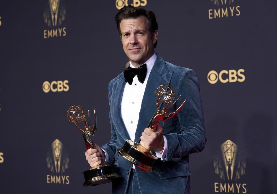 FILE - Jason Sudeikis appears with his awards for outstanding lead actor in a comedy series and best comedy series for "Ted Lasso" at the 73rd Primetime Emmy Awards in Los Angeles on Sept. 19, 2021. (AP Photo/Chris Pizzello, File)