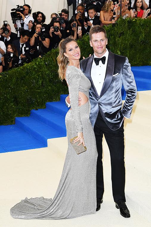 Gisele arrived on the arm of her husband Tom Brady in this figure-hugging cut-out gown.