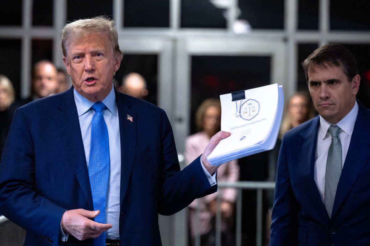 Donald Trump arrives for his trial on 26 April (POOL/AFP via Getty Images)