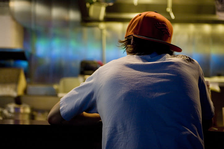 A man sitting at a bar