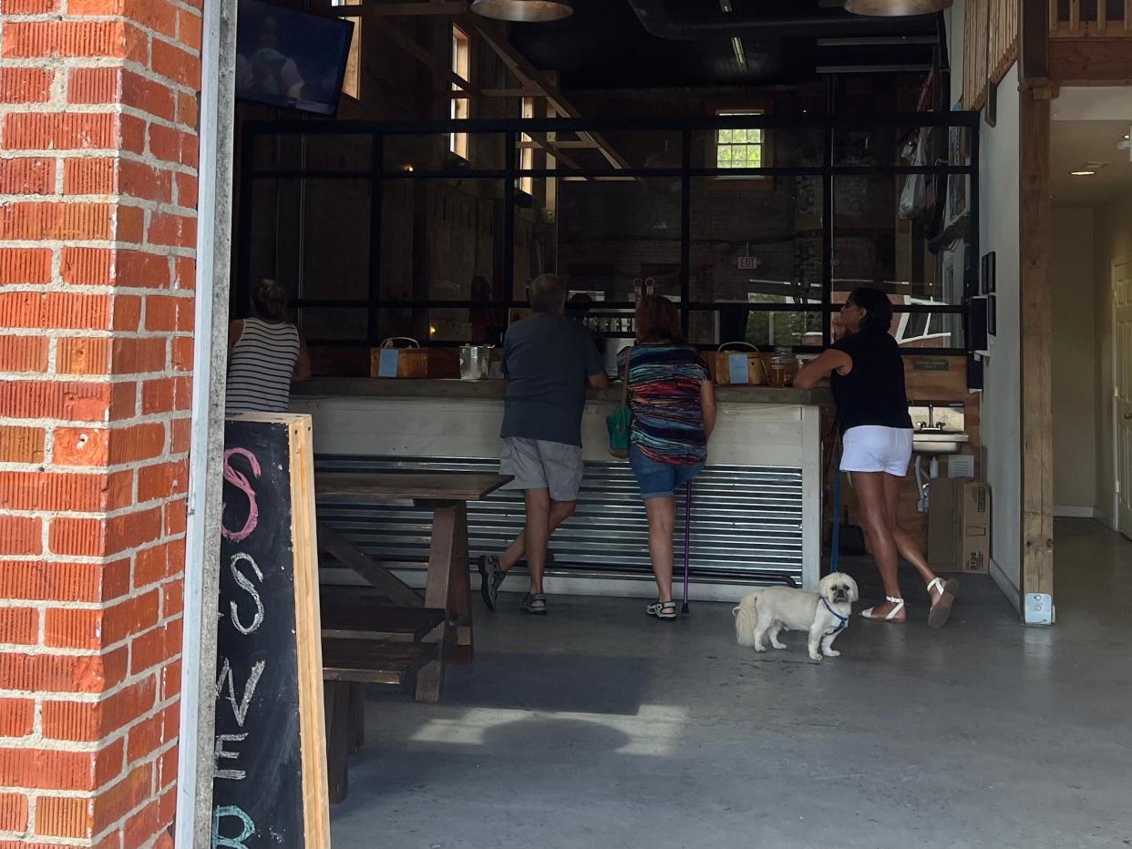 Shallotte locals gather at Red Hare Brewing Company, 4802 Main St., to say farewell to the local taproom. It will permanently close its doors on Sunday, Sept. 4, 2022, after four years in business.