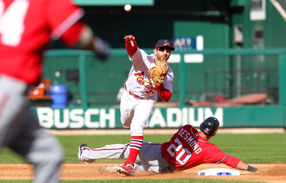 Ian Desmond #20 of the Washington Nationals slides into second to break up a double play as Daniel Descalso #33 of the St Louis Cardinals throws in the fourth inning during Game One of the National League Division Series at Busch Stadium on October 7, 2012 in St Louis, Missouri. (Photo by Dilip Vishwanat/Getty Images)