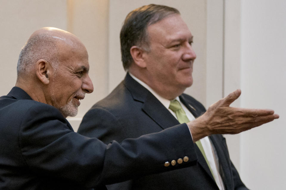 FILE - In this July 9, 2018 file photo, Afghan President Ashraf Ghani, left, and Secretary of State Mike Pompeo, arrive for a news conference in Kabul, Afghanistan. The longest direct talks ever held between the United States and the Taliban concluded this week. But in recent months, the U.S. has acquiesced to Taliban demands to keep the Afghan government on the sidelines. The US says they are working closely with the Afghan government and favor a dialogue between Kabul and the Taliban, but Ghani has yet to secure a seat at the table. (AP Photo/Andrew Harnik, Pool, File)