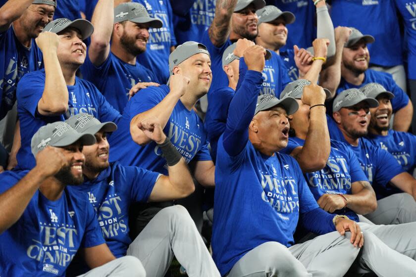 SEATTLE, WA - SEPTEMBER 16: Members of the Los Angeles Dodgers celebrate after clinching.