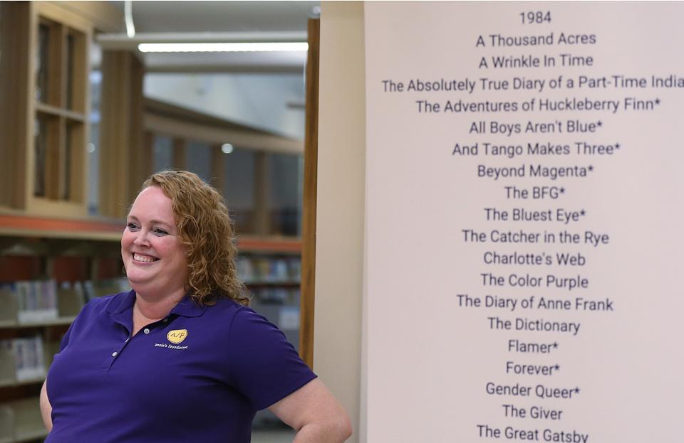 Sara Hayden Parris from Annie's Foundation talks to residents while distributing free books during a Banned Book Wagon tour at Nevada Library in November.