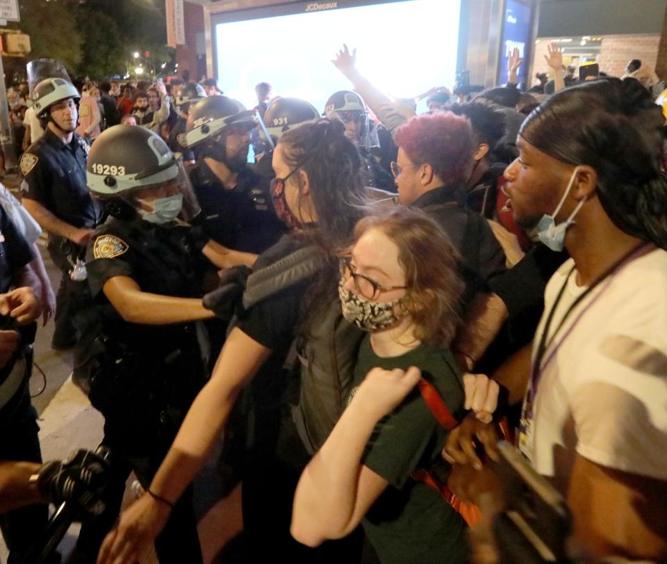 Members of the NYPD push protestors away from Union Square in Manhattan after protests started to get violent late in the evening May 30, 2020. Police started pushing back after protestors began throwing items at police. Protests and marches took place throughout the city for a second day over the death of George Floyd in Minneapolis. 