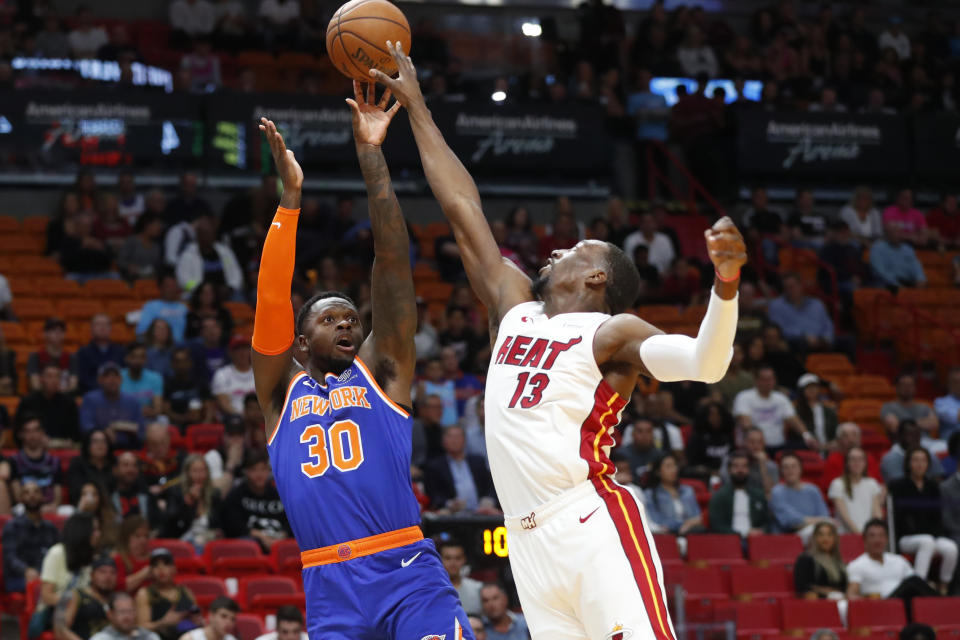 New York Knicks forward Julius Randle (30) shoots over Miami Heat center Bam Adebayo (13) during the first half of an NBA basketball game Friday, Dec. 20, 2019, in Miami. (AP Photo/Wilfredo Lee)