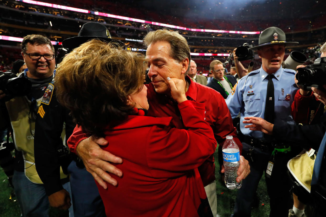 Head coach Nick Saban of the Alabama Crimson Tide celebrates with his wife Terry after beating the Georgia Bulldogs.