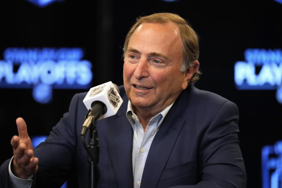 FILE - NHL Commissioner Gary Bettman talks during a news conference before Game 1 of an NHL hockey Stanley Cup second-round playoff series between the Colorado Avalanche and the St. Louis Blues in Denver, Tuesday, May 17, 2022. Bettman has said fighting has a place in keeping down the temperature of games. (AP Photo/Jack Dempsey, File)