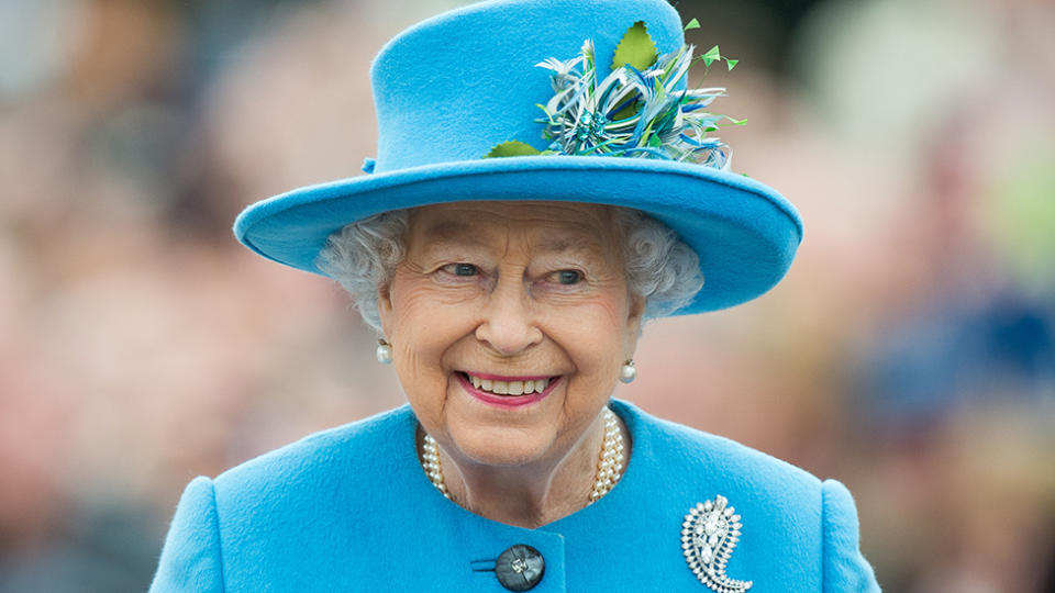 The Queen in a blue outfit