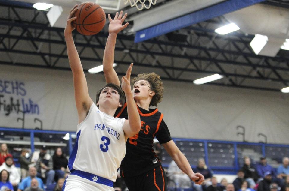 Southeastern's Joey Pfeifer (#3) goes up for a layup during the Panthers' game against the Amanda-Clearcreek Aces at Southeastern High School on Dec. 23, 2023, in Chillicothe, Ohio. Southeastern won the game 58-33
