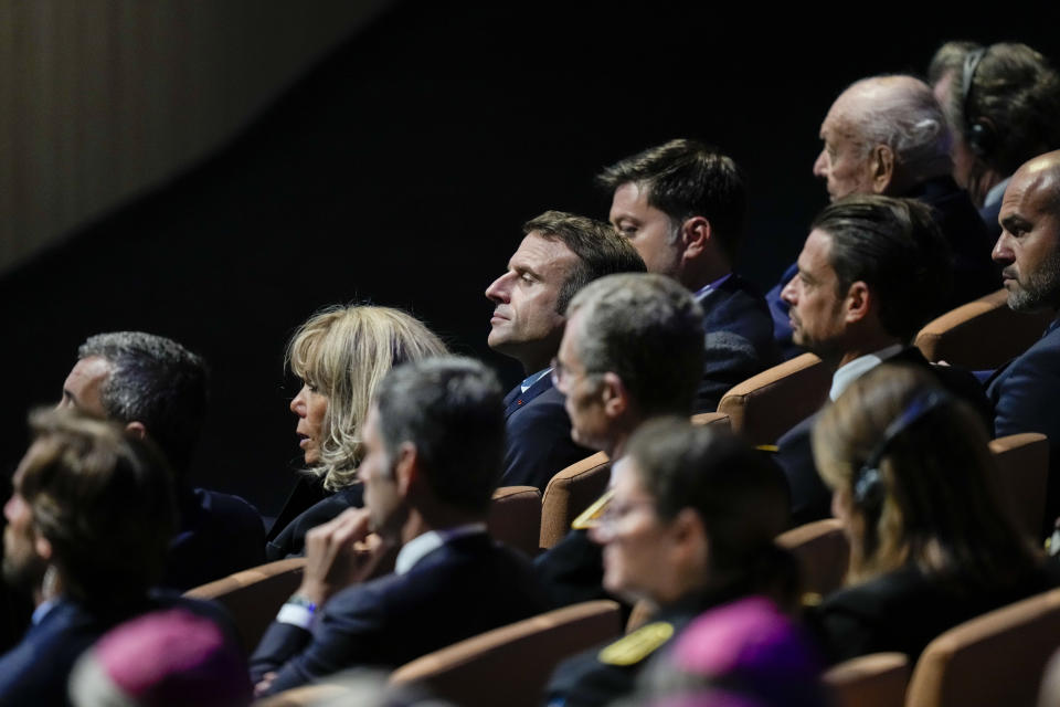 French President Emmanuel Macron, center, and his wife Brigitte, at his left, listen to Pope Francis as he delivers his speechs at the final session of the "Rencontres Mediterraneennes" meeting at the Palais du Pharo, in Marseille, France, Saturday, Sept. 23, 2023. Francis, during a two-day visit, will join Catholic bishops from the Mediterranean region on discussions that will largely focus on migration. (AP Photo/Pavel Golovkin)