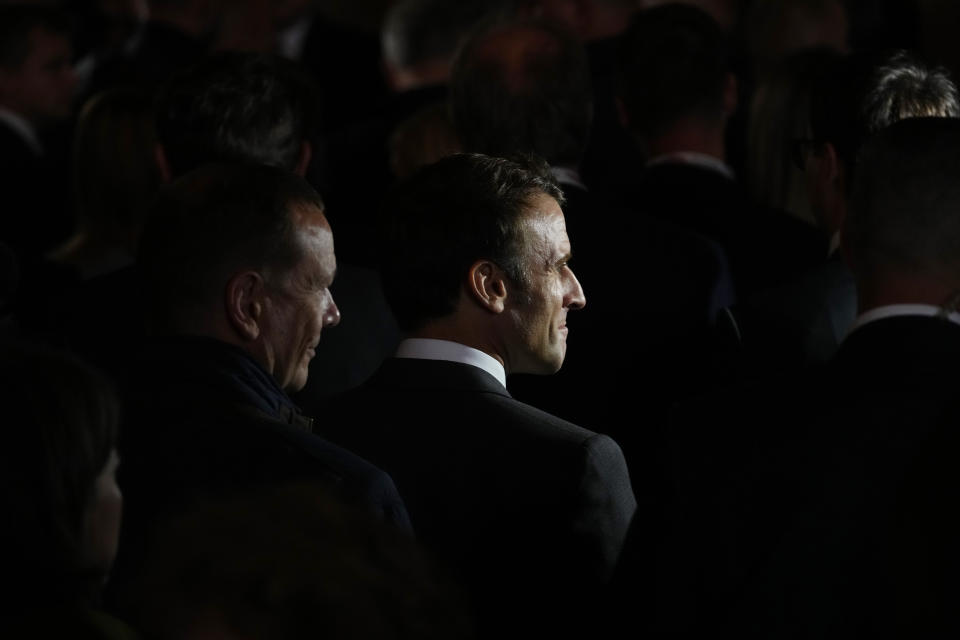 France's President Emmanuel Macron, center, walks with other leaders after a group photo during meeting of the European Political Community at Prague Castle in Prague, Czech Republic, Thursday, Oct 6, 2022. Leaders from around 44 countries are gathering Thursday to launch a "European Political Community" aimed at boosting security and economic prosperity across the continent, with Russia the one major European power not invited. (AP Photo/Petr David Josek)