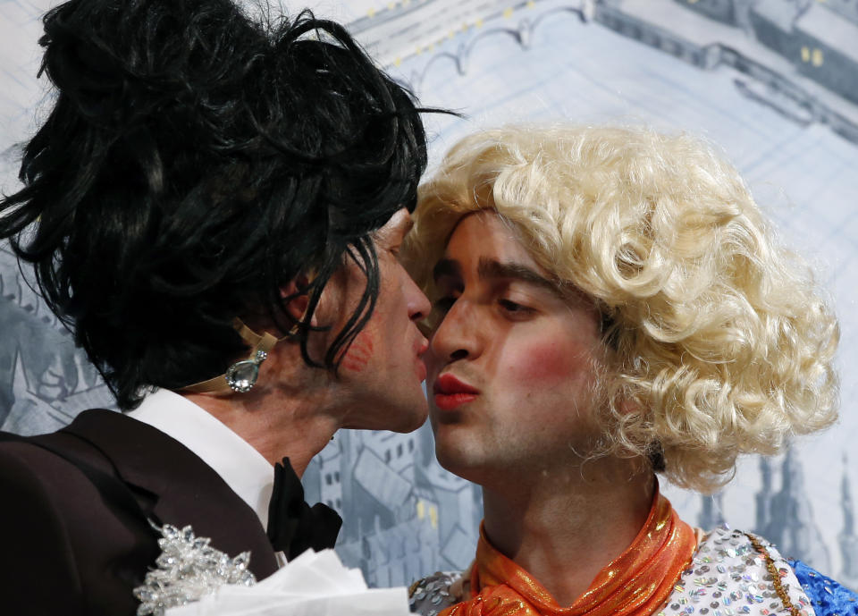 Actor Neil Patrick Harris, left, kisses an actor in drag during his roast as Man of The Year by Harvard University's Hasty Pudding Theatricals in Cambridge, Mass., Friday, Feb. 7, 2014. (AP Photo/Elise Amendola)