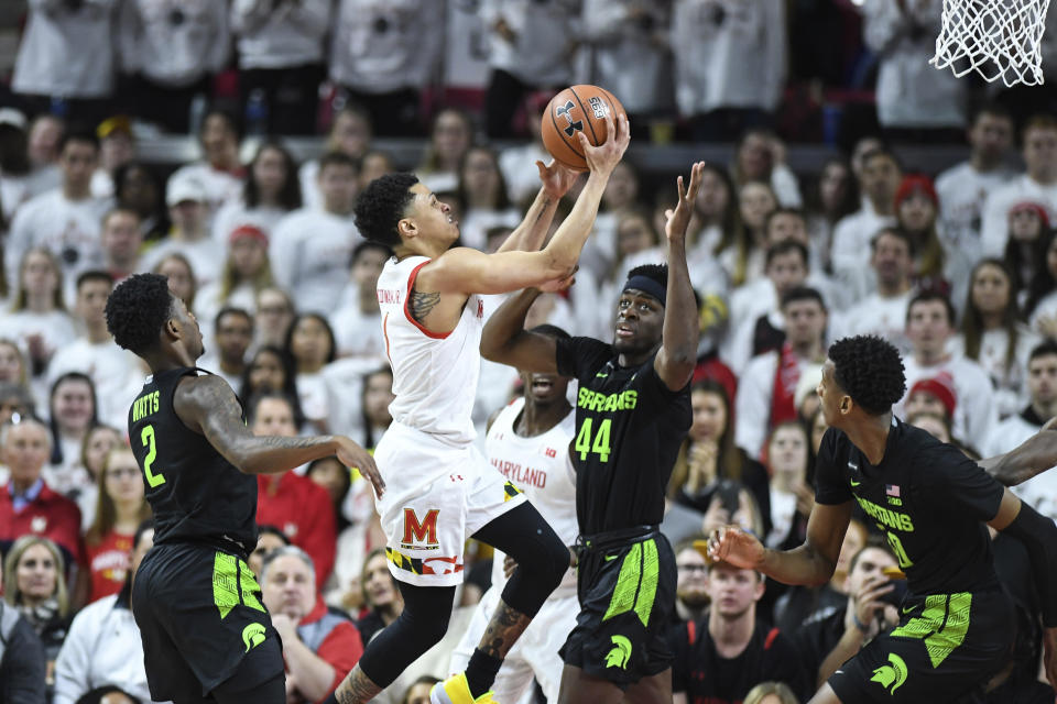 Maryland guard Anthony Cowan Jr. (1) goes to the basket for a layup during the first half against the of an NCAA college basketball game against the Michigan State, Saturday, Feb. 29, 2020, in College Park, Md. (AP Photo/Terrance Williams)