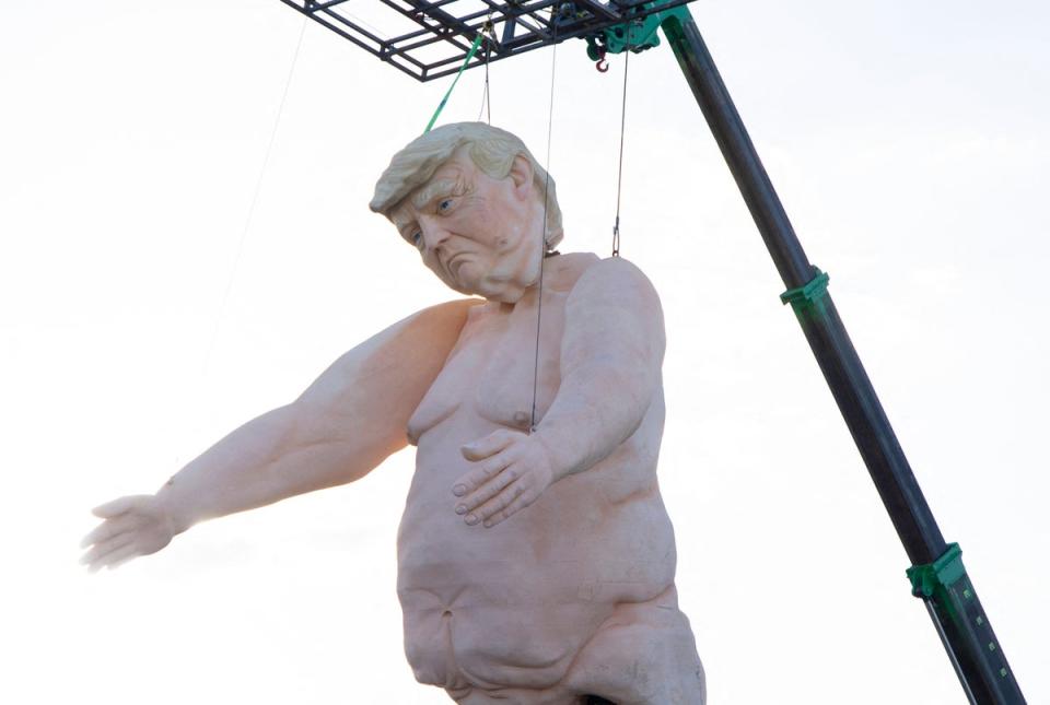 A 43ft naked statue resembling Donald Trump is erected in a fenced-in lot near Interstate 15 north of Las Vegas, Nevada on September 28. (AFP via Getty Images)