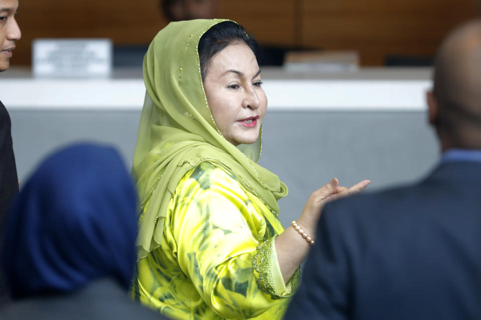 FILE - Rosmah Mansor, wife of Malaysian Prime Minister Najib Razak, arrives at the Anti-Corruption Agency for questioning in Putrajaya, on Oct. 3, 2018. Former first lady Rosmah was convicted Thursday, Sept. 1, 2022, of soliciting and receiving bribes during her husband’s corruption-tainted administration Thursday, a week after her husband was imprisoned over the massive looting of the 1MDB state fund.(AP Photo/Vincent Thian, File)