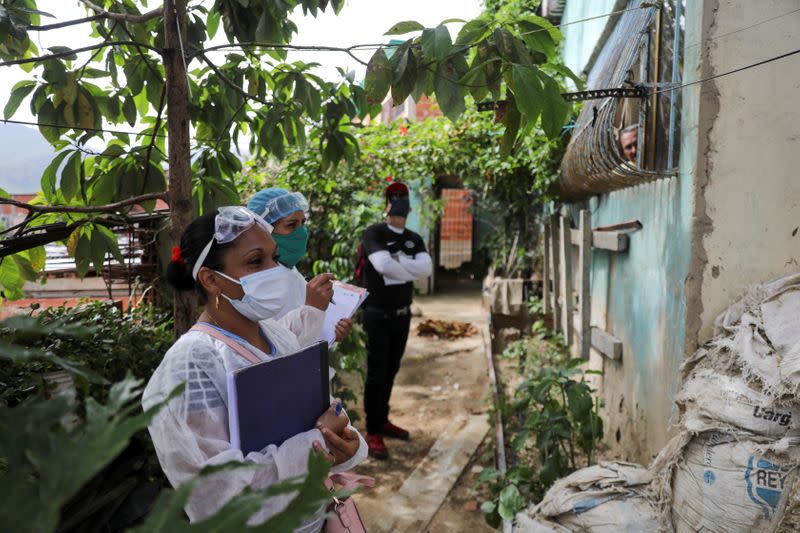 Doctors take a walking round at the low-income neighborhood of Las Mayas, as cases rise amid the coronavirus disease (COVID-19) outbreak, in Caracas