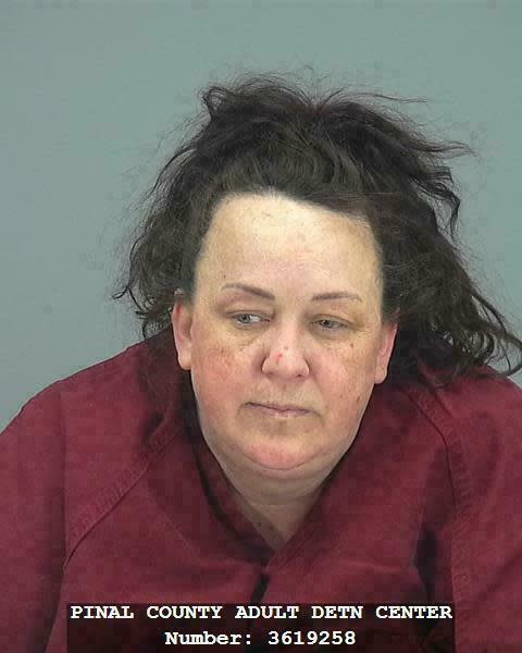 CORRECTS LAST NAME FROM HACKNEY TO HOBSON This booking photo provided by Pinal County Sheriff’s Office shows Machelle Hobson. Authorities say, Tuesday, March 19, 2019, Hobson is accused of abusing seven adopted children, including using pepper spray on them and locking them in a closet. Hobson was booked into the Pinal County Jail on suspicion of two counts of molestation of a child, seven counts of child abuse and five counts each of unlawful imprisonment and child neglect. (Pinal County Sheriff’s Office via AP)