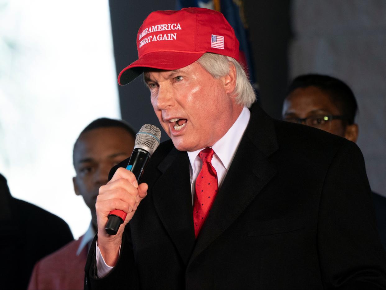 Attorney Lin Wood speaks during a press conference on election results in Alpharetta, Georgia, on 2 December 2020 ((Reuters))