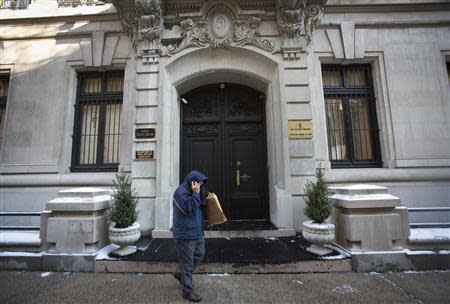 A man walks past the Indian Consulate in New York December 18, 2013. India has transferred Devyani Khobragade, a deputy consul general at the Indian Consulate in New York whose arrest led to a diplomatic row between the two countries, to the Indian Mission to the United Nations for full diplomatic immunity, Indian media said Wednesday. Khobragade was arrested on December 12 on charges of visa fraud and underpaying her housekeeper. REUTERS/Carlo Allegri