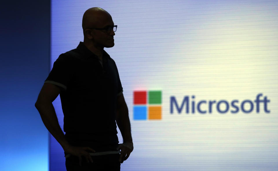 FILE- In this May 7, 2018, file photo Microsoft CEO Satya Nadella looks on during a video as he delivers the keynote address at Build, the company's annual conference for software developers in Seattle. Amazon and Microsoft are battling for a $10 billion opportunity to build the U.S. military its first “war cloud.” (AP Photo/Elaine Thompson, File)