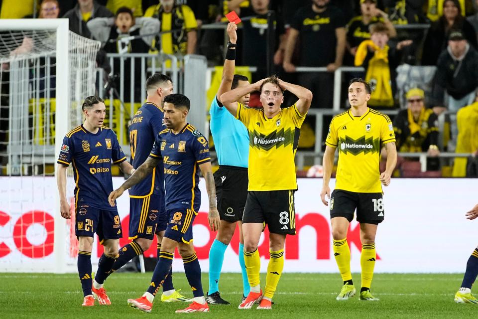 Apr 2, 2024; Columbus, OH, USA; Columbus Crew midfielder Aidan Morris (8) reacts to being given a red card during the second half of the Concacaf Champions Cup quarterfinal against Tigres UANL at Lower.com Field. The game ended in a 1-1 tie. Mandatory Credit: Adam Cairns-USA TODAY Sports