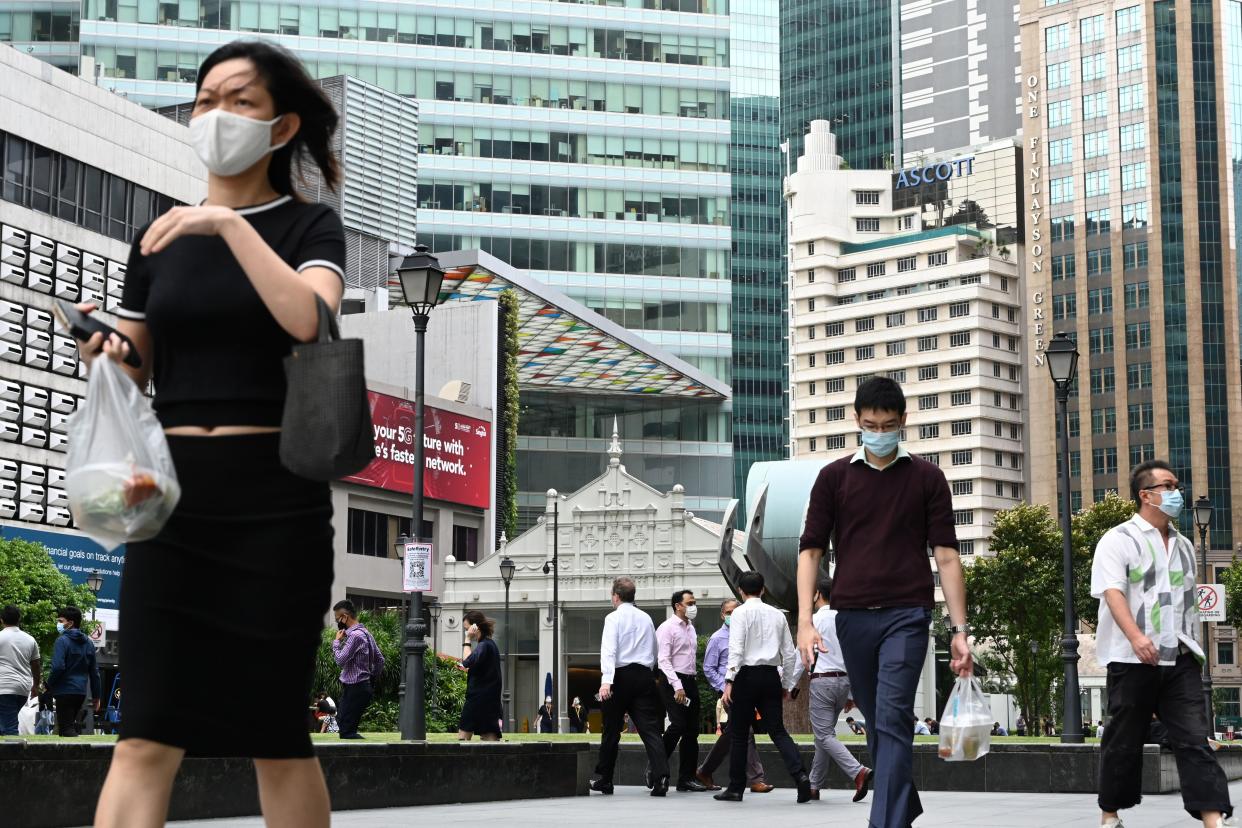 People seen in the financial business district of Raffles Place on 11 January. (PHOTO: Getty Images)