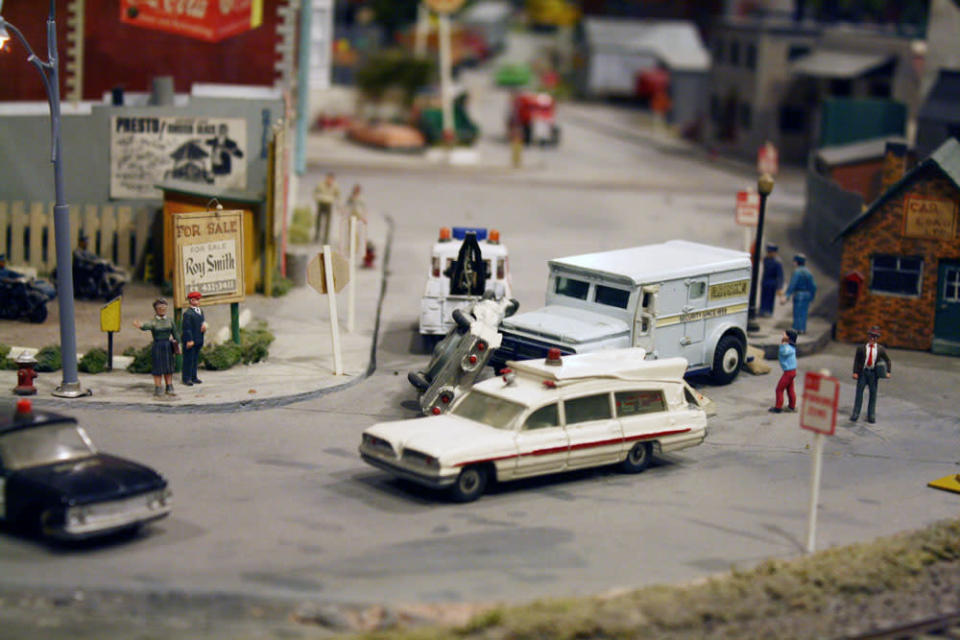 A car flips over while being towed in one of the many miniature quarky scenes. After 67 years in the Liberty Village location, The Model Railroad Club of Toronto will be moving to make way for a condo. s