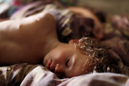 Krystle Jackson's son, Kavon Jackson, 1, sleeps in his parents house in Cedar Lake, Indiana, U.S. September 16, 2016. REUTERS/Michelle Kanaar