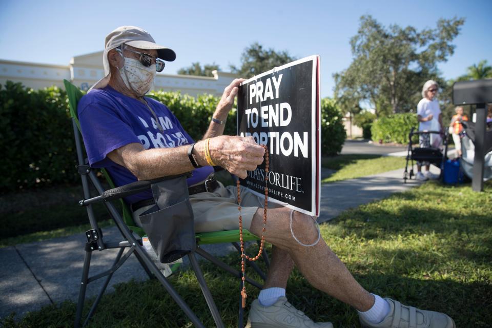 Fort Myers resident, Brian Walker protests abortion outside of Planned Parenthood in Fort Myers on Thursday, October 15, 2020. He condemned the incident involving the molotov cocktail being thrown at the building over last weekend. He said "That's not what we are all about, it's wrong, we are all about love."