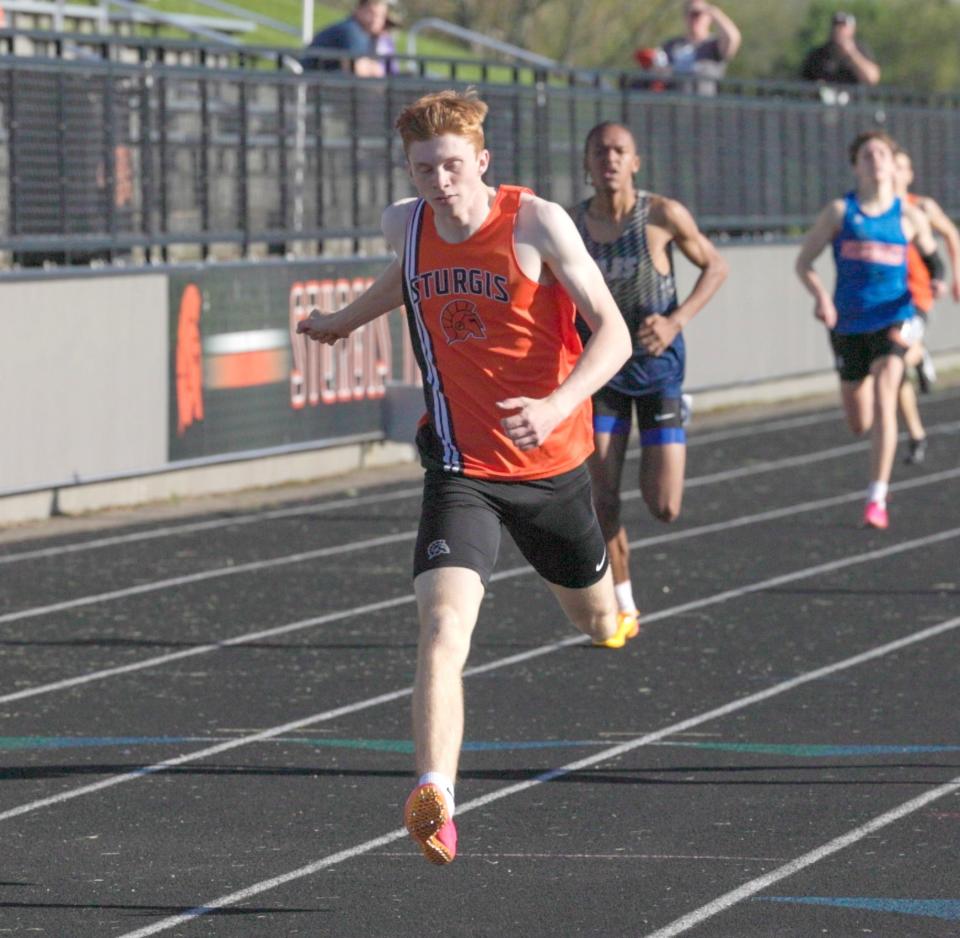 Zach Green crosses the finish line to win the 400 run on Tuesday.