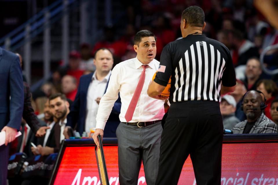 Cincinnati Bearcats head coach Wes Miller talks to a referee during the first half of an NCAA men’s college basketball game on Sunday, March 5, 2023, at Fifth Third Arena in Cincinnati, concluding the Bearcats’ regular season. 