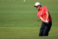 MELBOURNE, AUSTRALIA - NOVEMBER 18: Aaron Baddeley of the International Team hits an approach shot on the first hole during the Day Two Four-Ball Matches of the 2011 Presidents Cup at Royal Melbourne Golf Course on November 18, 2011 in Melbourne, Australia. (Photo by Scott Halleran/Getty Images)