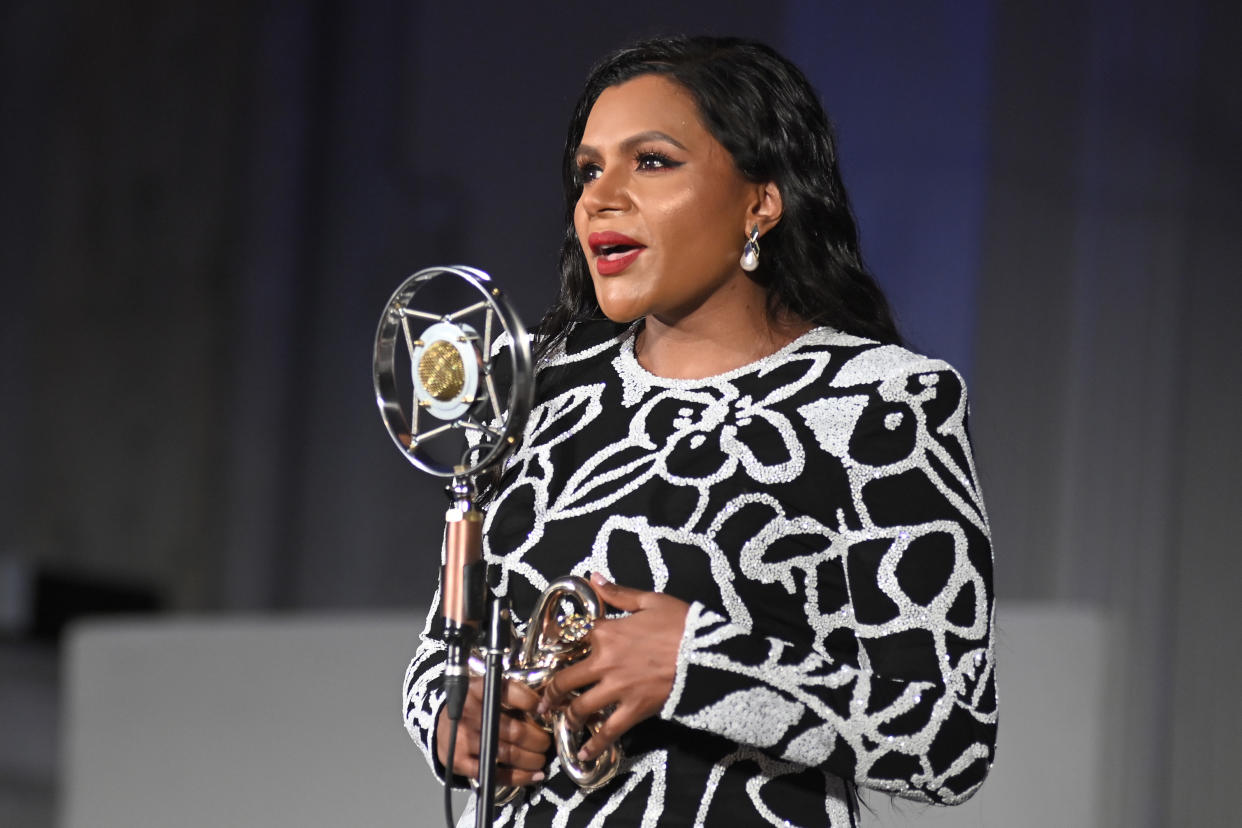 Mindy Kaling shared her latest fashion post on Instagram this weekend, where she shines in a bright aqua jacket and dress set. (Photo by Stefanie Keenan/Getty Images for Gold House)