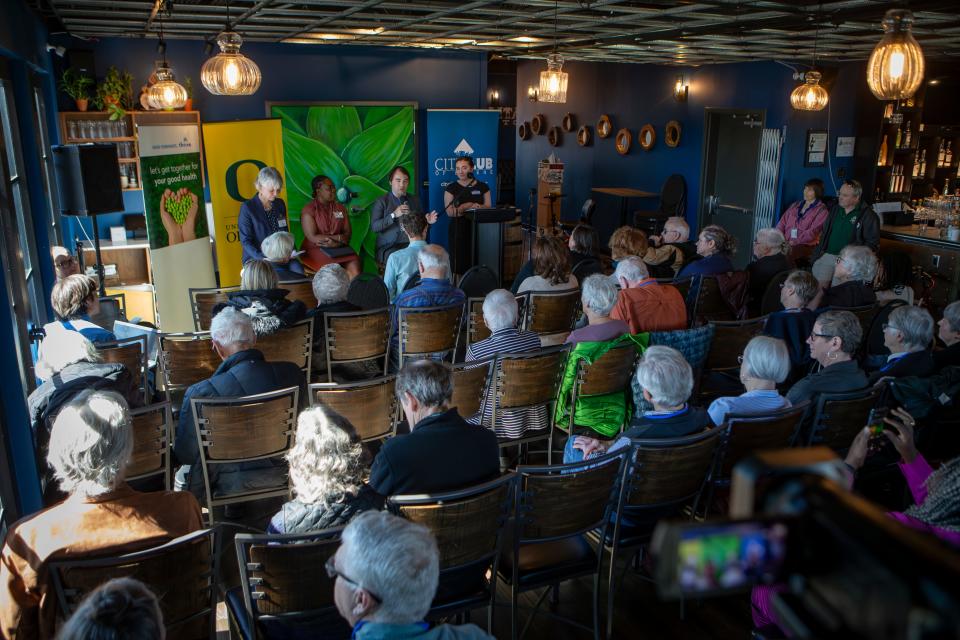 Kaarin Knudson, left, Shanae Joyce-Stringer and Stefan Strek answer questions during a forum for Eugene’s mayoral candidates March 15 in Eugene.