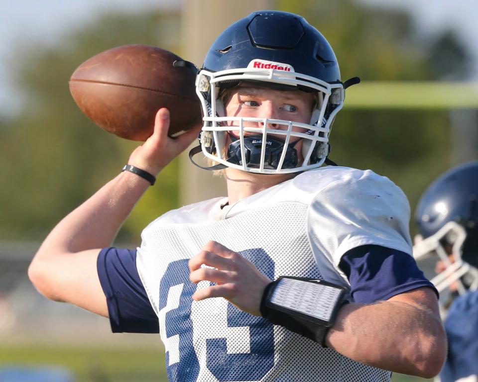 Walton QB Wells Bettenhausen passes during a football practice at Walton High School.