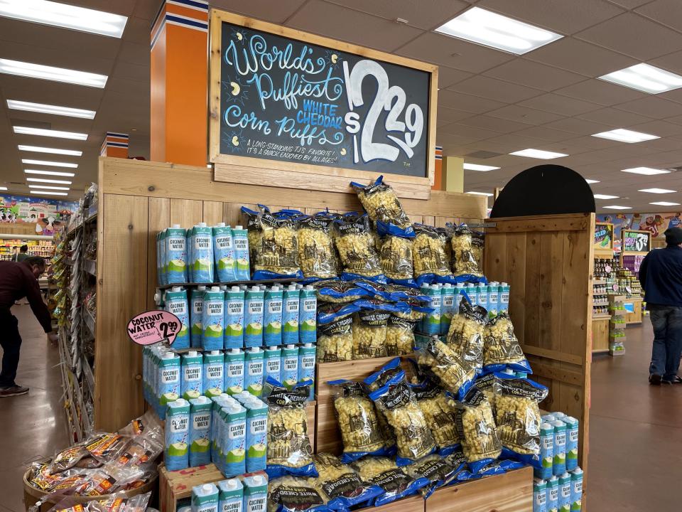 trader joe's white cheddar puffs in display