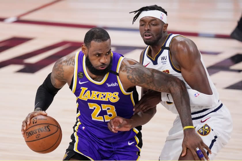 Los Angeles Lakers' LeBron James (23) drives against Denver Nuggets' Jerami Grant.